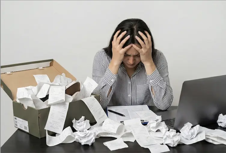 Woman overwhelmed by receipts